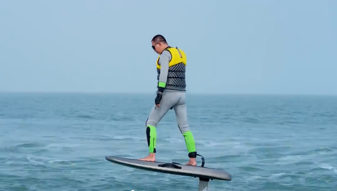 A 50-year-old man is riding a Waydoo Flyer One efoil to cross the strait